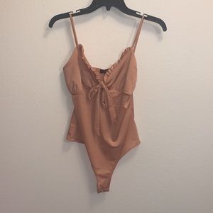 Lulu’s salmon pink bodysuit